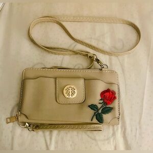 Floral embroidered tan wristlet crossbody